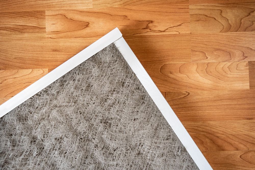 A close up of a filter on a wooden floor.