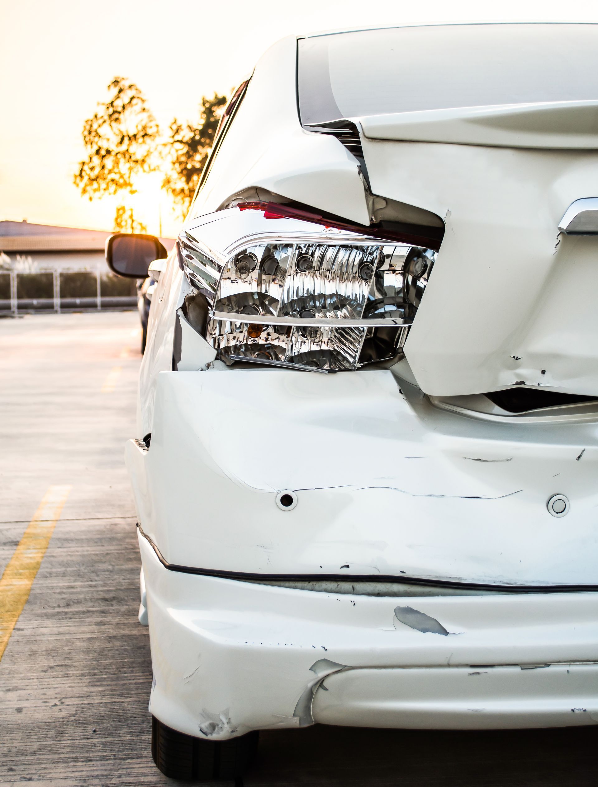 totaled but still drivable car, back bumper damage