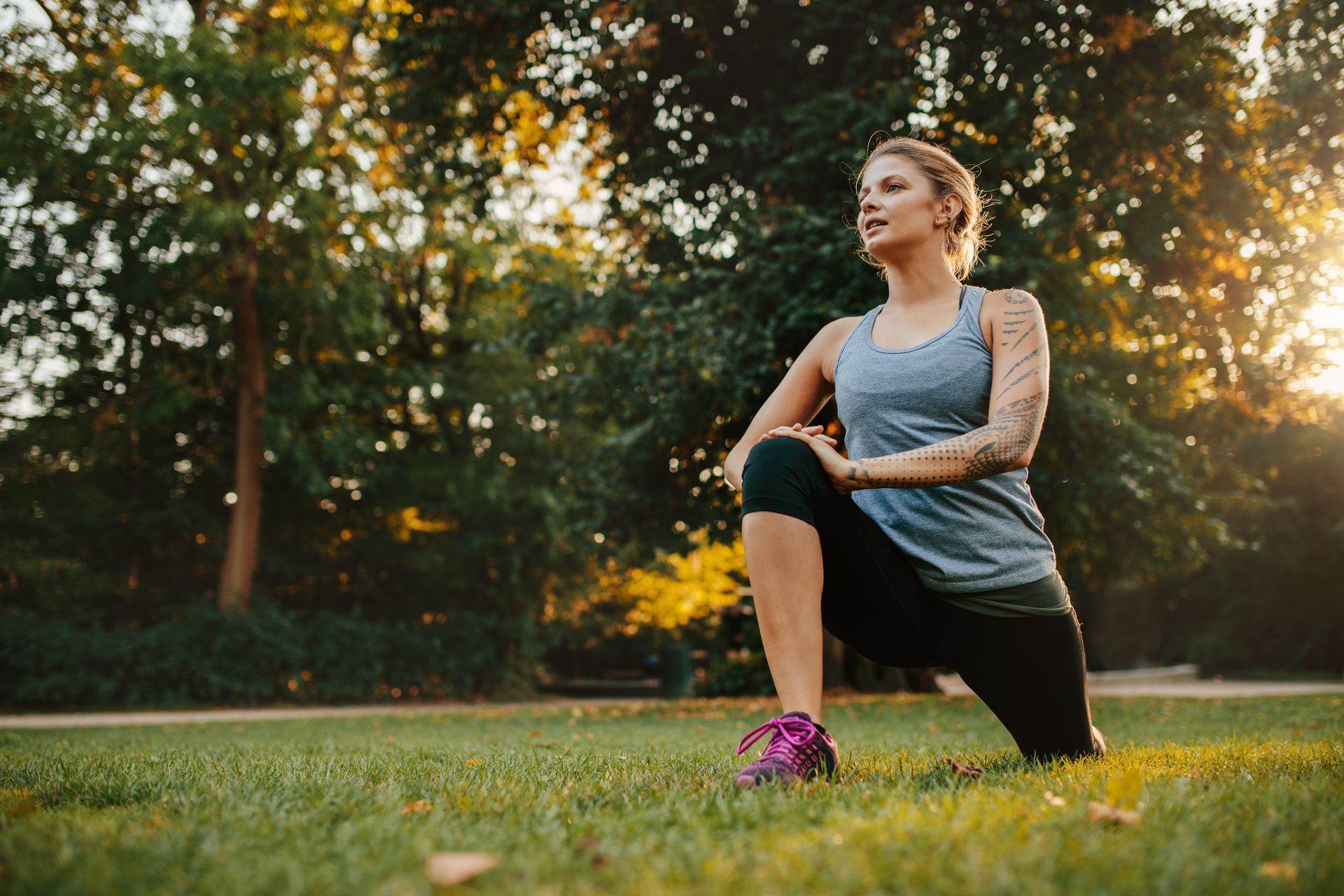 one of the partners practicing a lunge in their pre-workout routine