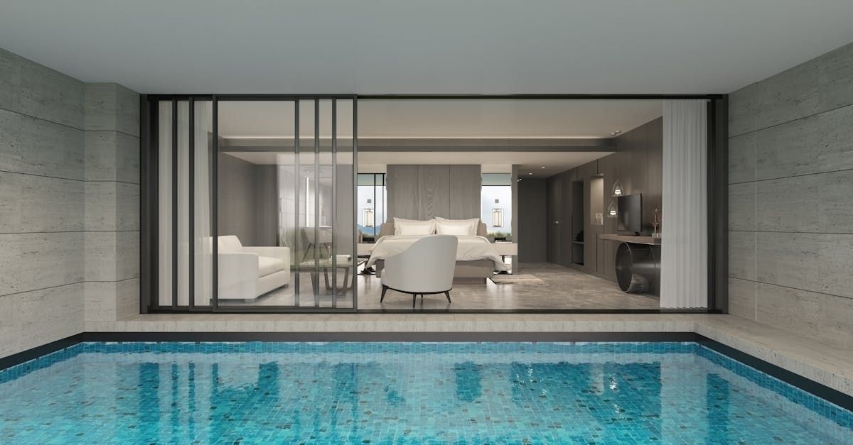 An artist 's impression of a room with a swimming pool.