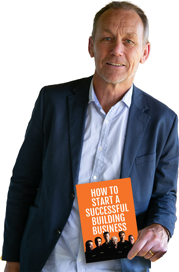Russell Poole holding How to Start a Successful Building Business eBook