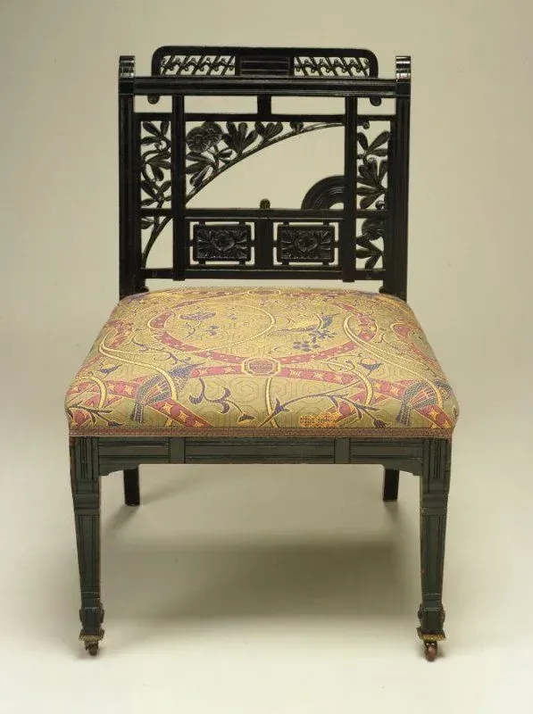 A chair with a floral pattern on the seat and back