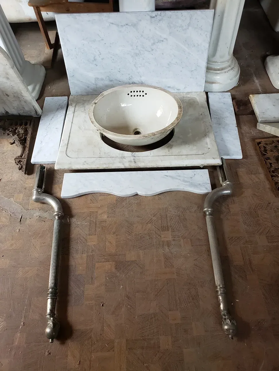 A sink is sitting on top of a marble counter top.