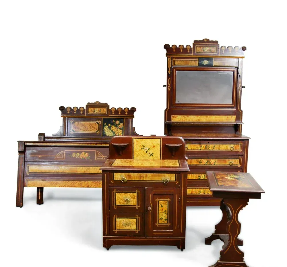 A bedroom set with a bed dresser and desk