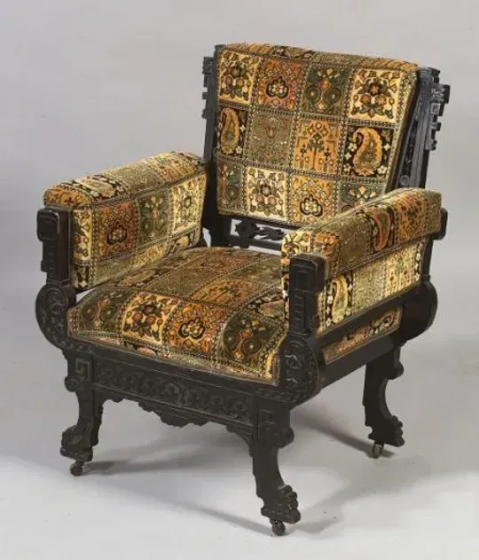 A chair with a paisley pattern on it