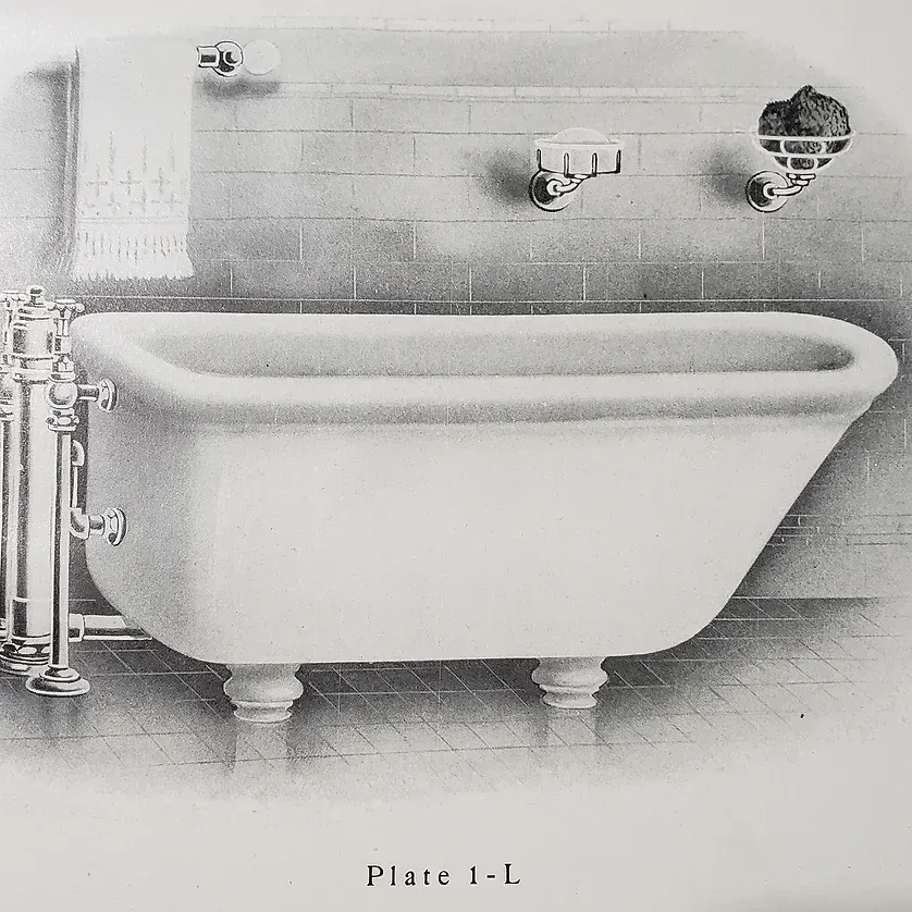 A black and white drawing of a bathtub with plate 1 l below it