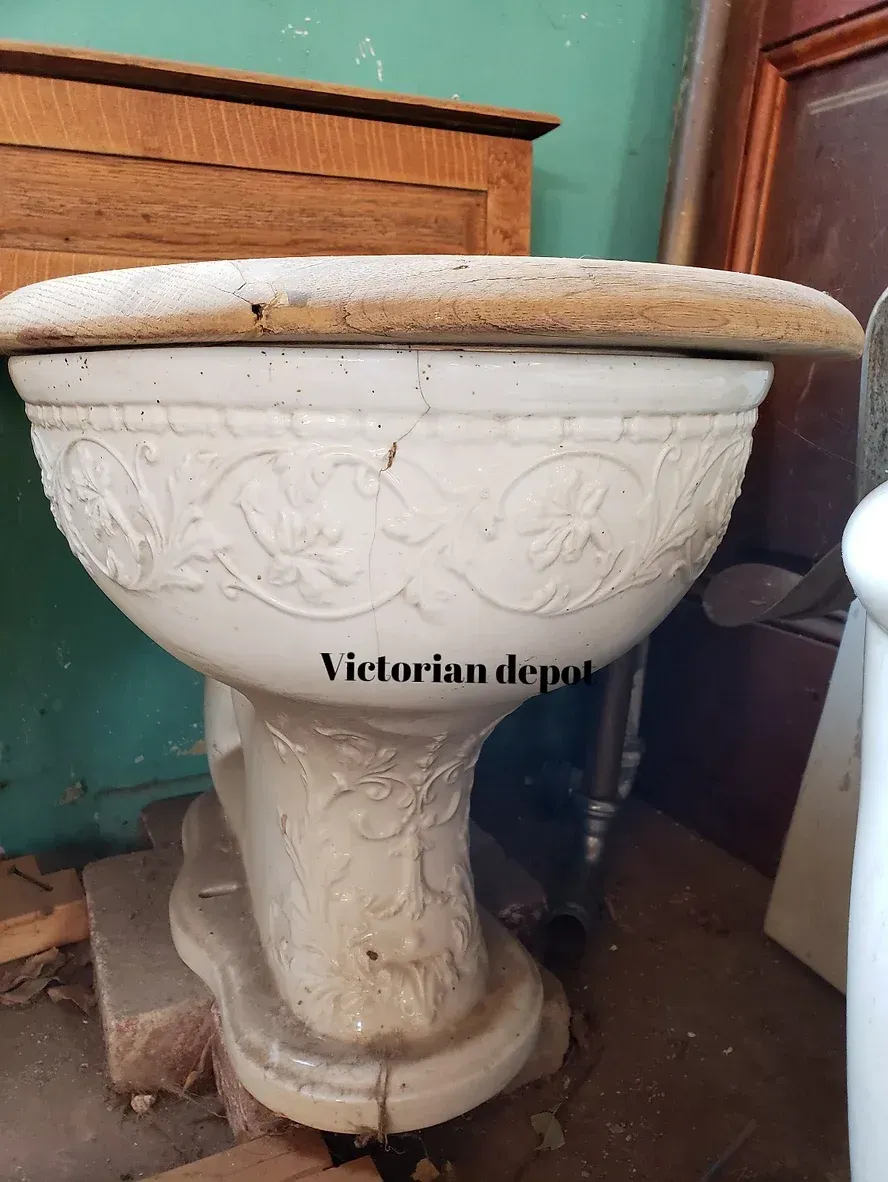 A white toilet with the words victorian depot on it