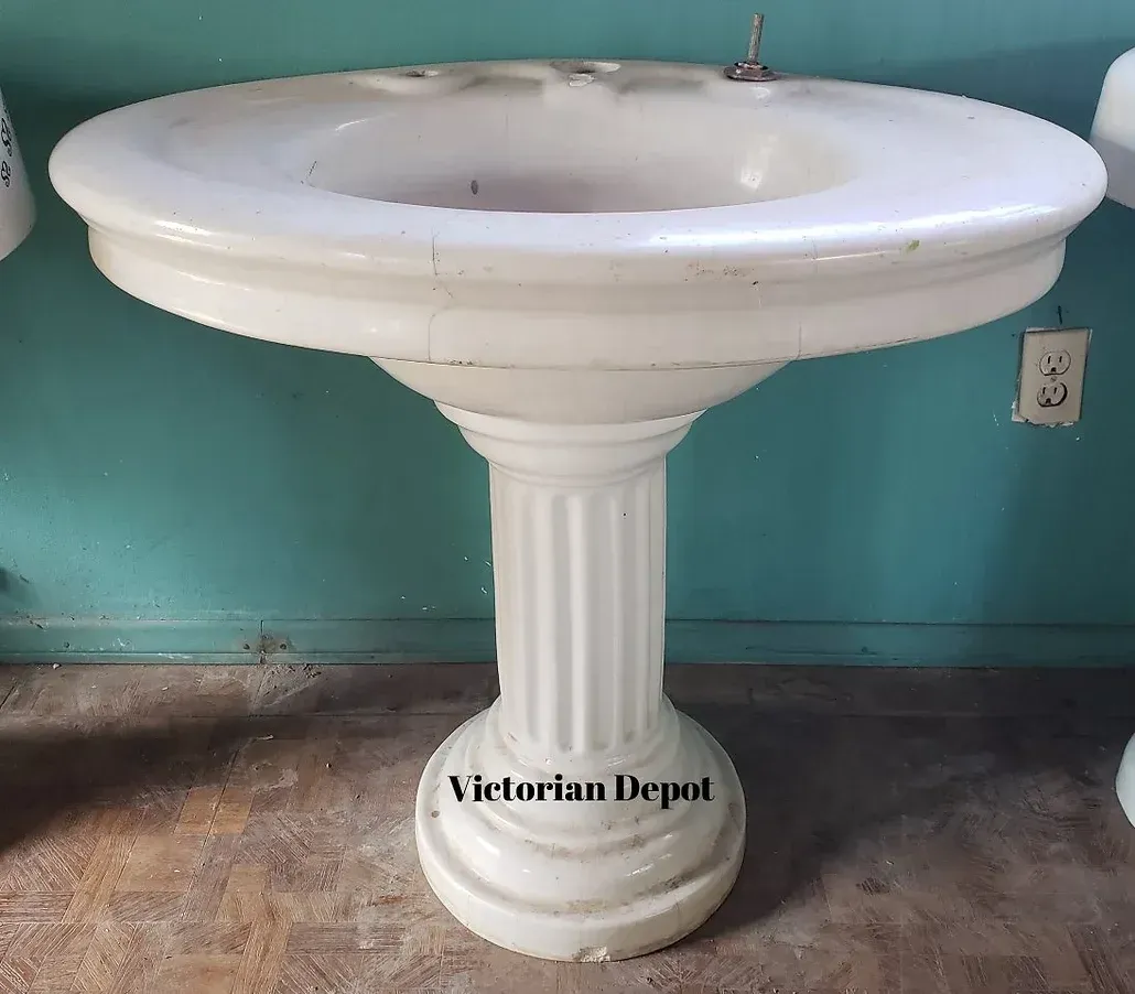 A white pedestal sink from the victorian depot