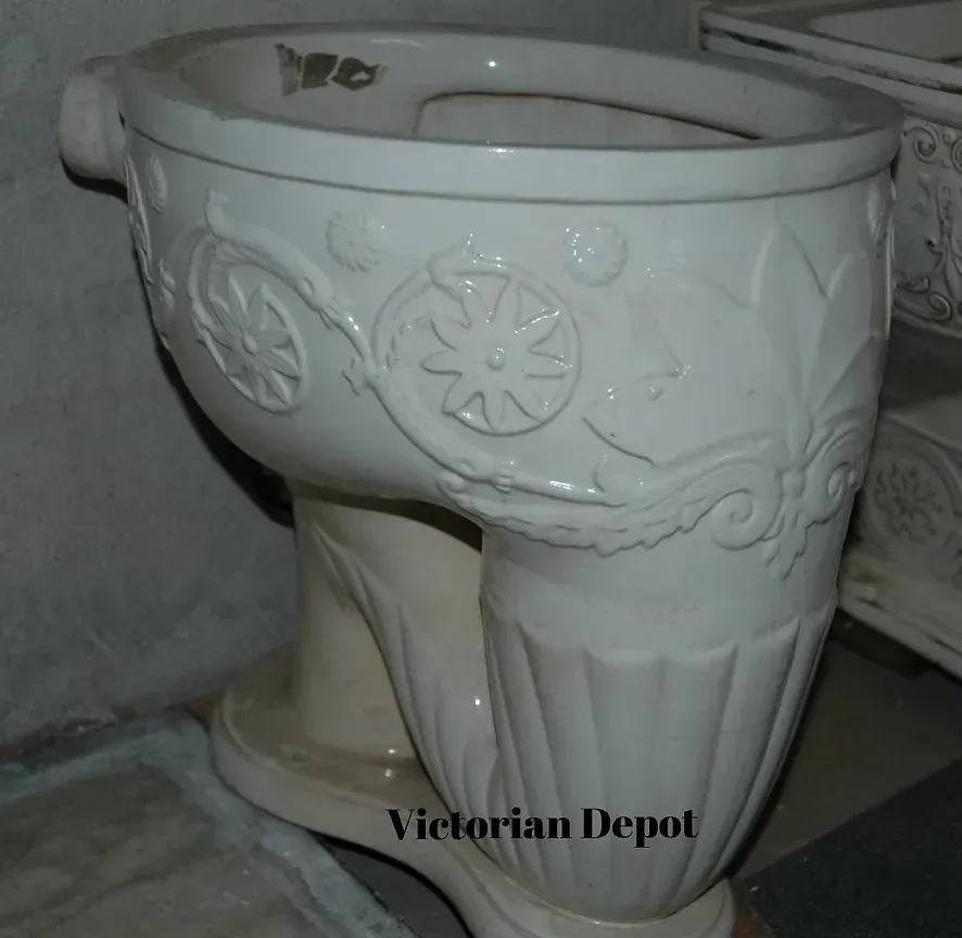 A white toilet with the words victorian depot below it
