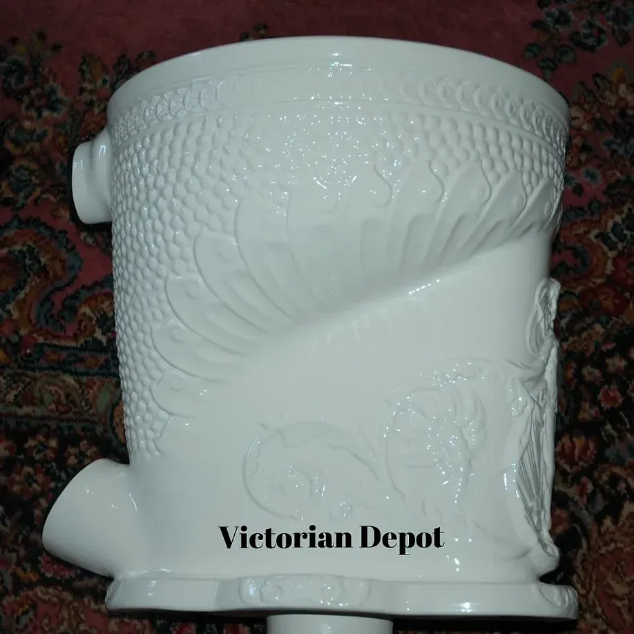 A white vase with victorian depot written on it