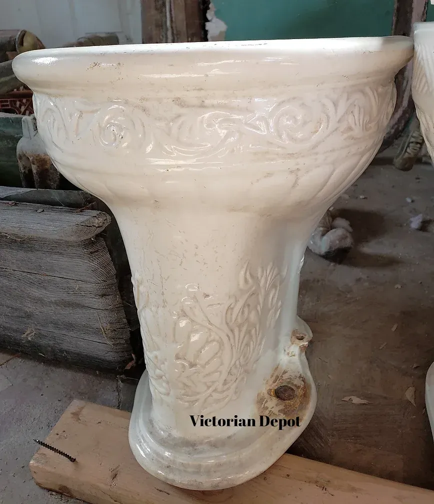 A victorian depot toilet sits on a wooden table