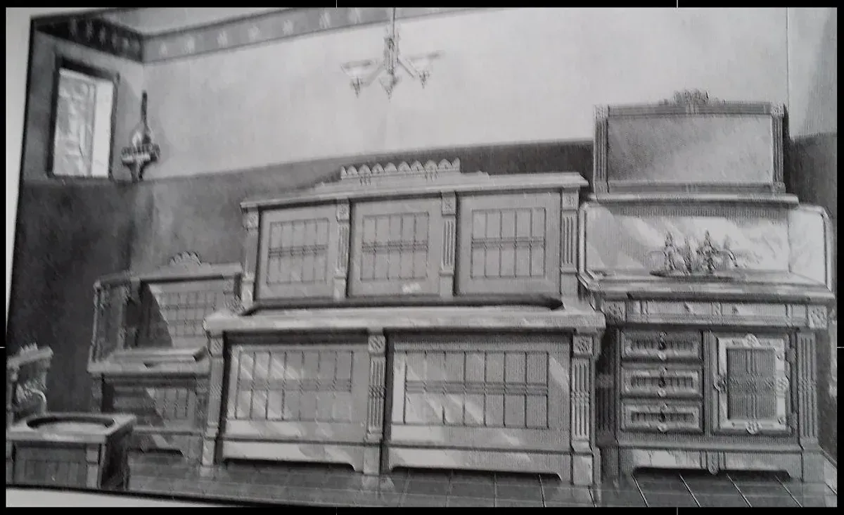 A black and white photo of a kitchen with a stove and cabinets