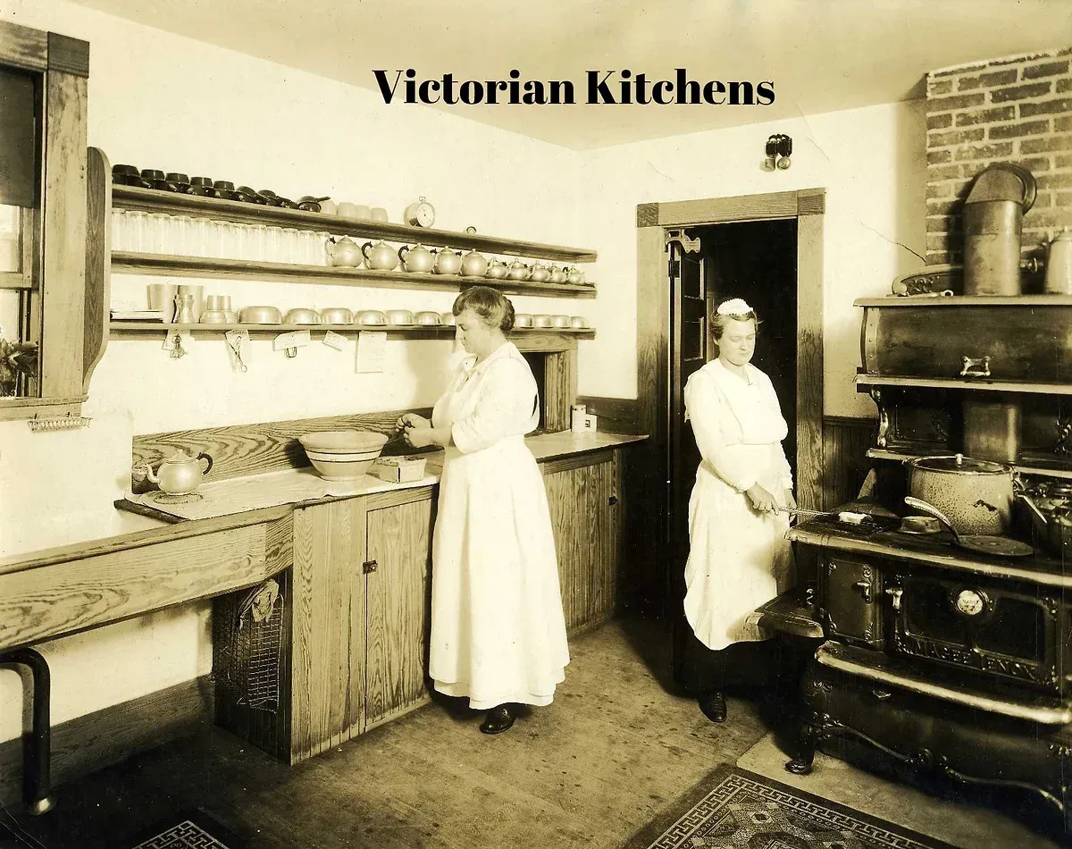A black and white photo of two women in a victorian kitchen