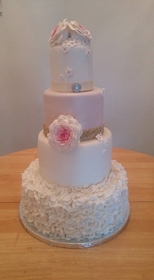 Wedding Cakes — Beautiful Four Layer Cake With Flower Icing Design In Colorado Springs, CO
