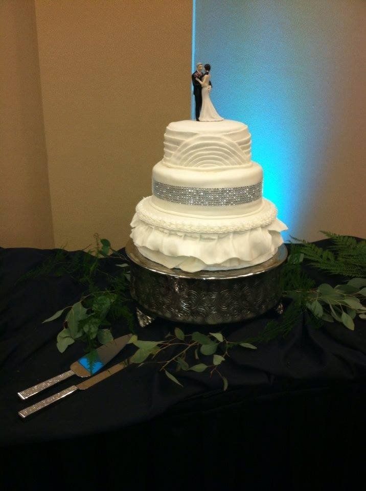 Expensive Cake — Three Layer Cake With Silver Design And Groom And Bride Topper In Colorado Springs, CO