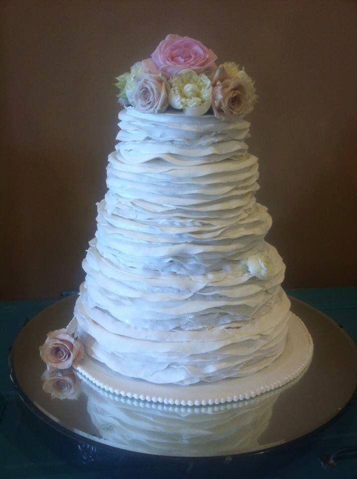 Wedding Cake Bakery — Cake Wrap With Icing In Colorado Springs, CO