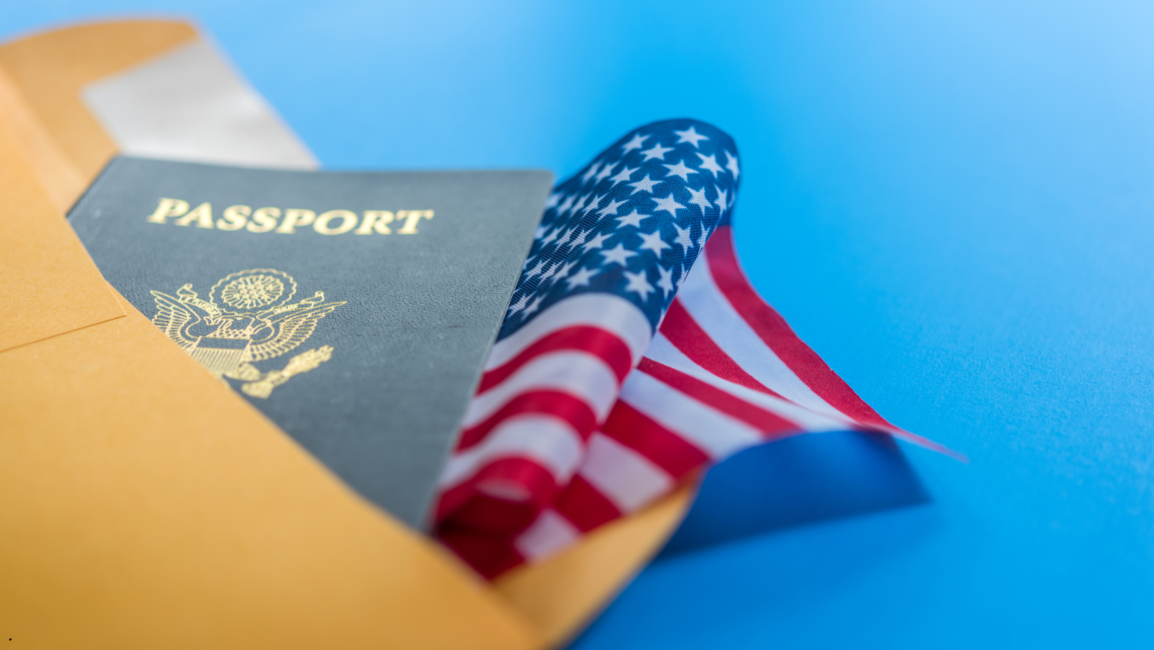 An american flag is sticking out of a passport.