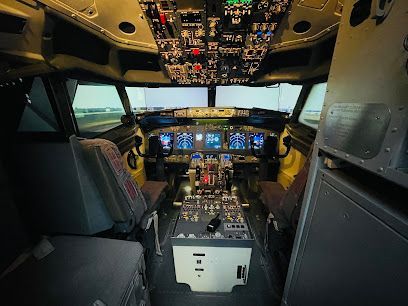Airplane cockpit interior with pilot and co-pilot seats. Numerous controls and screens are visible.
