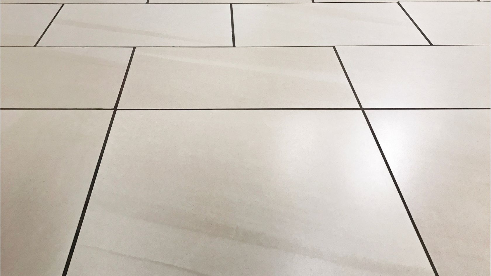 A close up of a marble floor with a checkered pattern