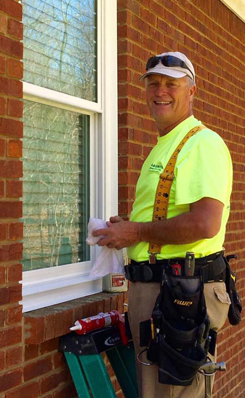Man Installing Windows - Vinyl Window Installation in Huntsville, Al