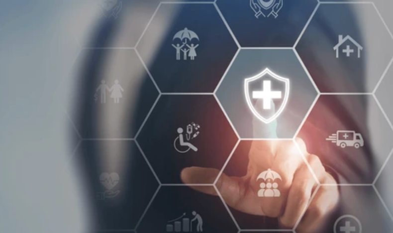 Person's finger touching a glowing health insurance shield icon among other insurance icons.