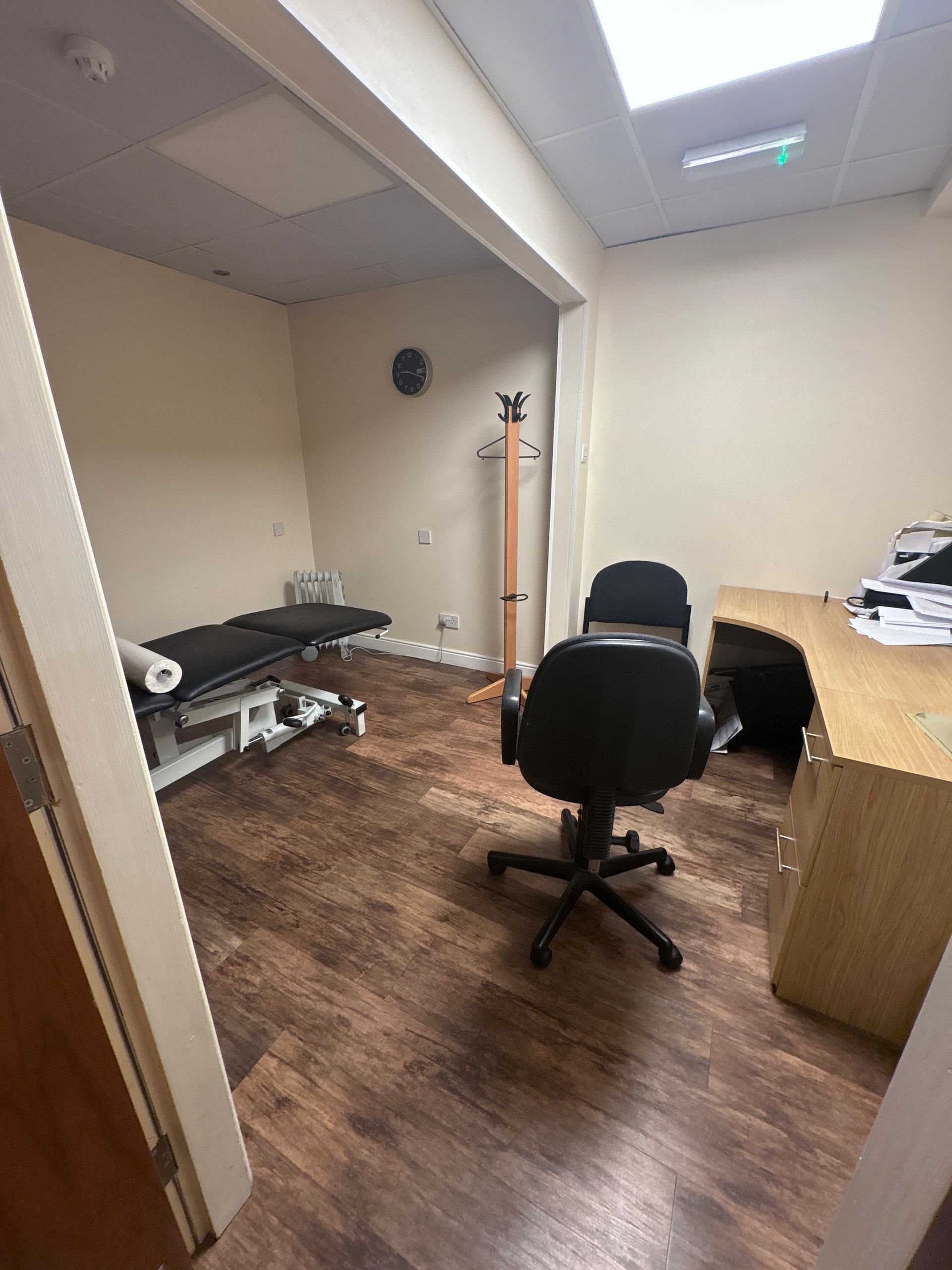 A vacuum cleaner is sitting on the floor in a room under construction.