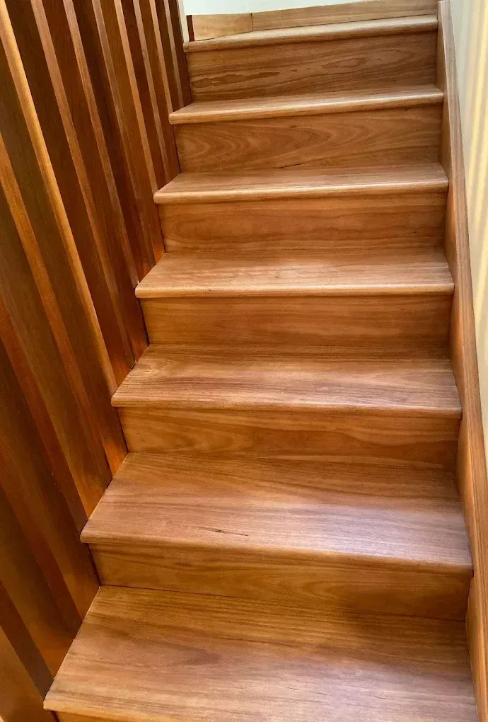 A Hallway With Smooth Hardwood Floors and a Yellow Cord — Tweed Coast Cork & Timber Floors In Tweed Heads, NSW