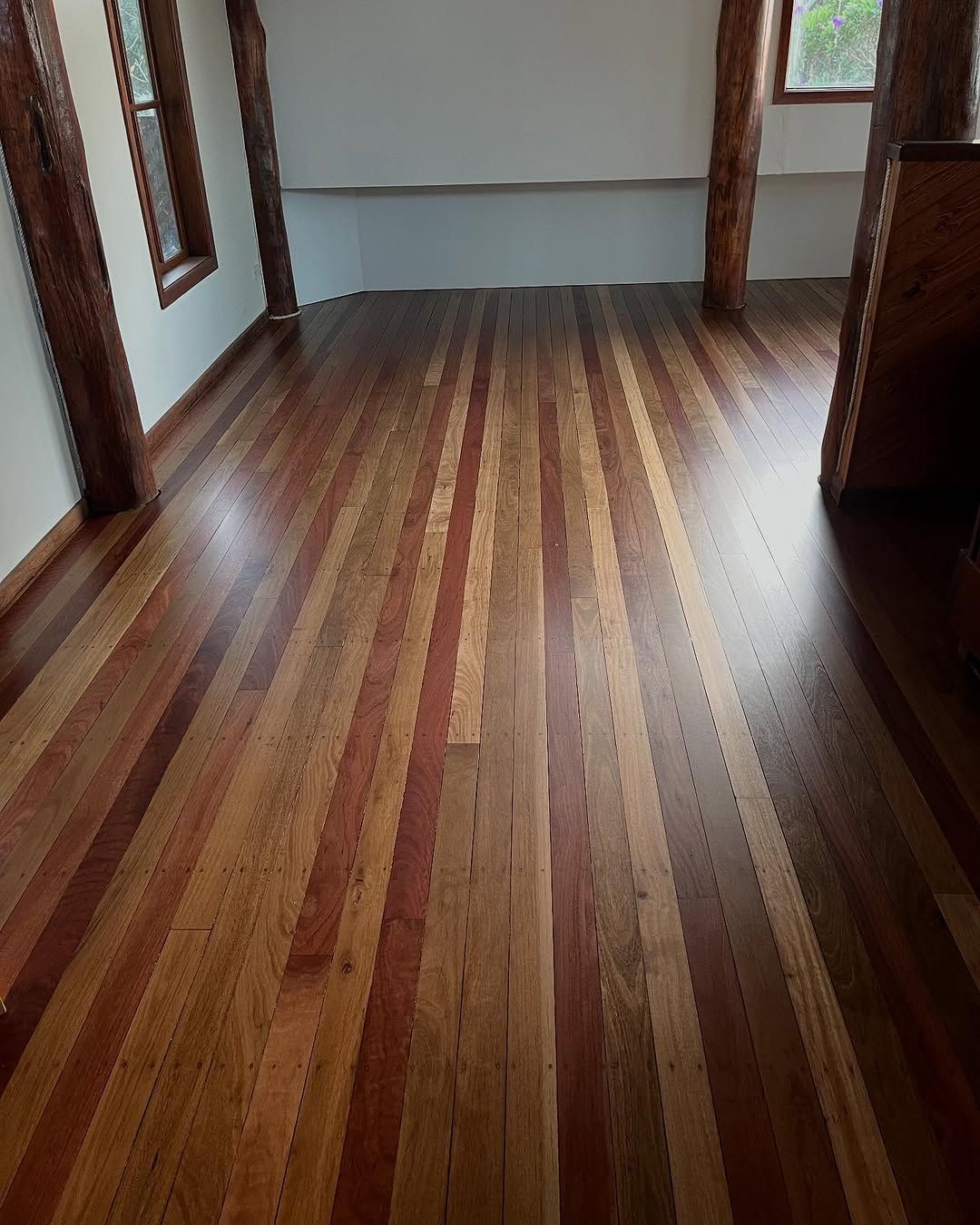 Timber Floor With Sunlight And Shadows From A Window — Tweed Coast Cork & Timber Floors In Tweed Heads, NSW