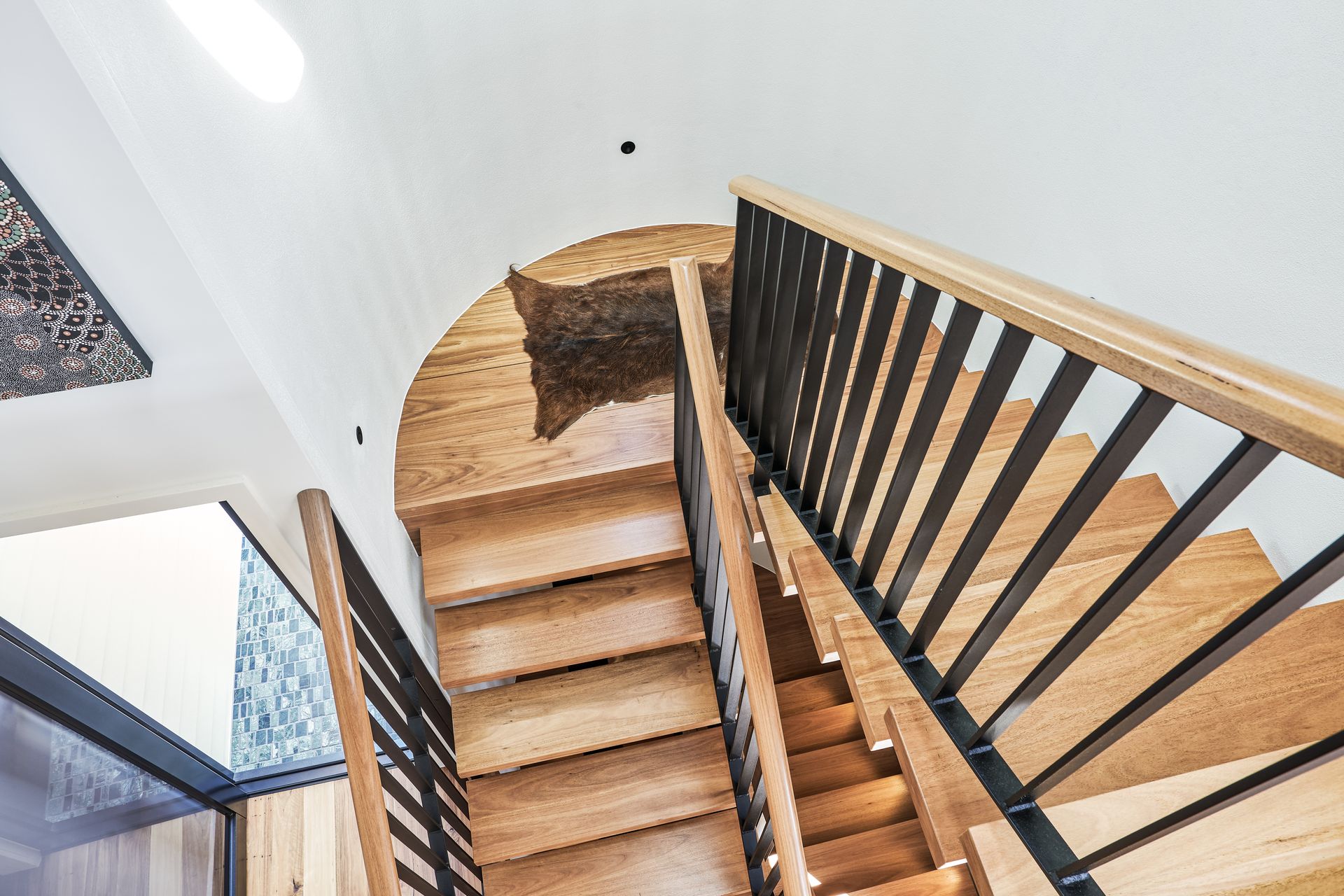 A Room With a Wooden Floor and a Door Leading to a Bathroom — Tweed Coast Cork & Timber Floors In Tweed Heads, NSW
