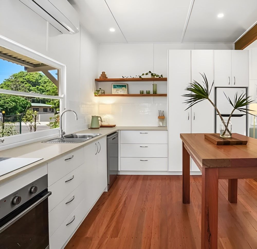 A Room With a Wooden Floor and a Sliding Glass Door — Tweed Coast Cork & Timber Floors In Tweed Heads, NSW