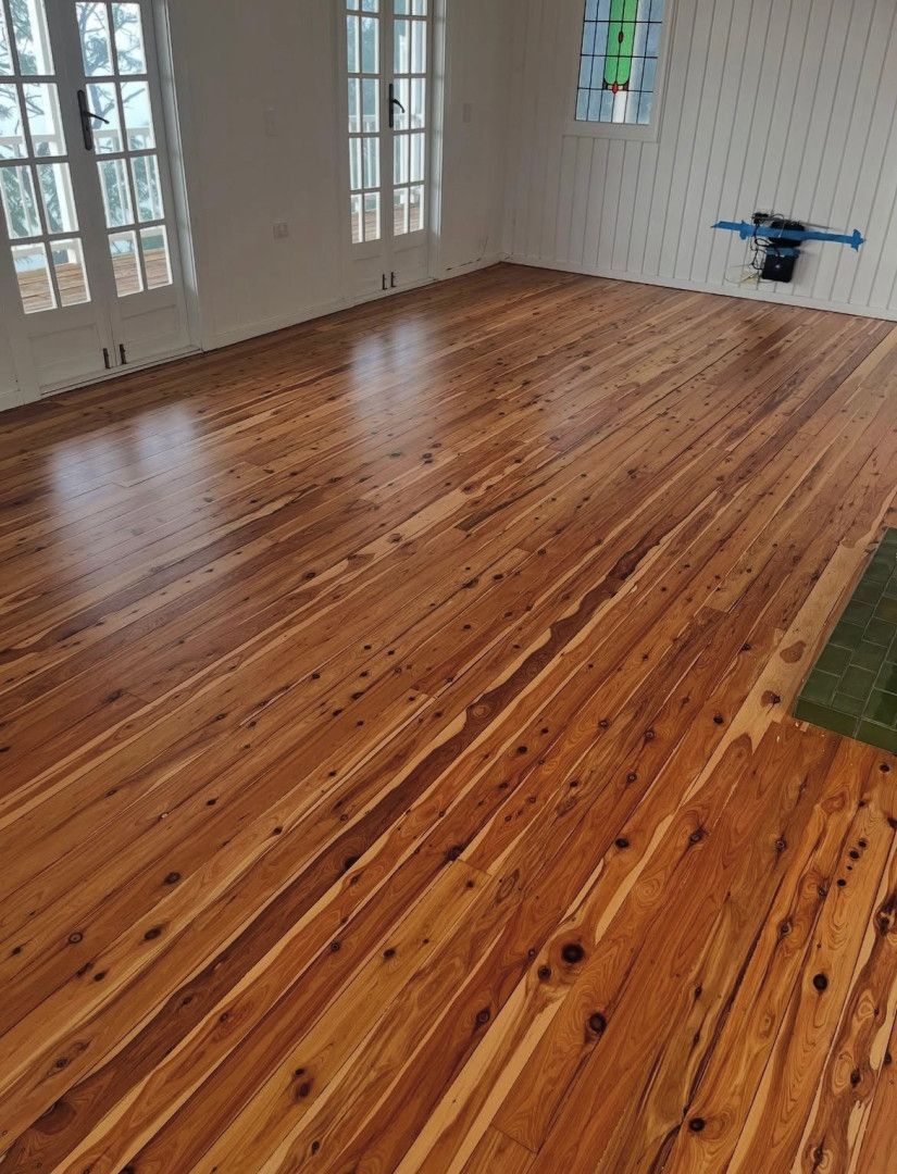 A Hallway With Hardwood Floors and a Yellow Cord — Tweed Coast Cork & Timber Floors In Tweed Heads, NSW
