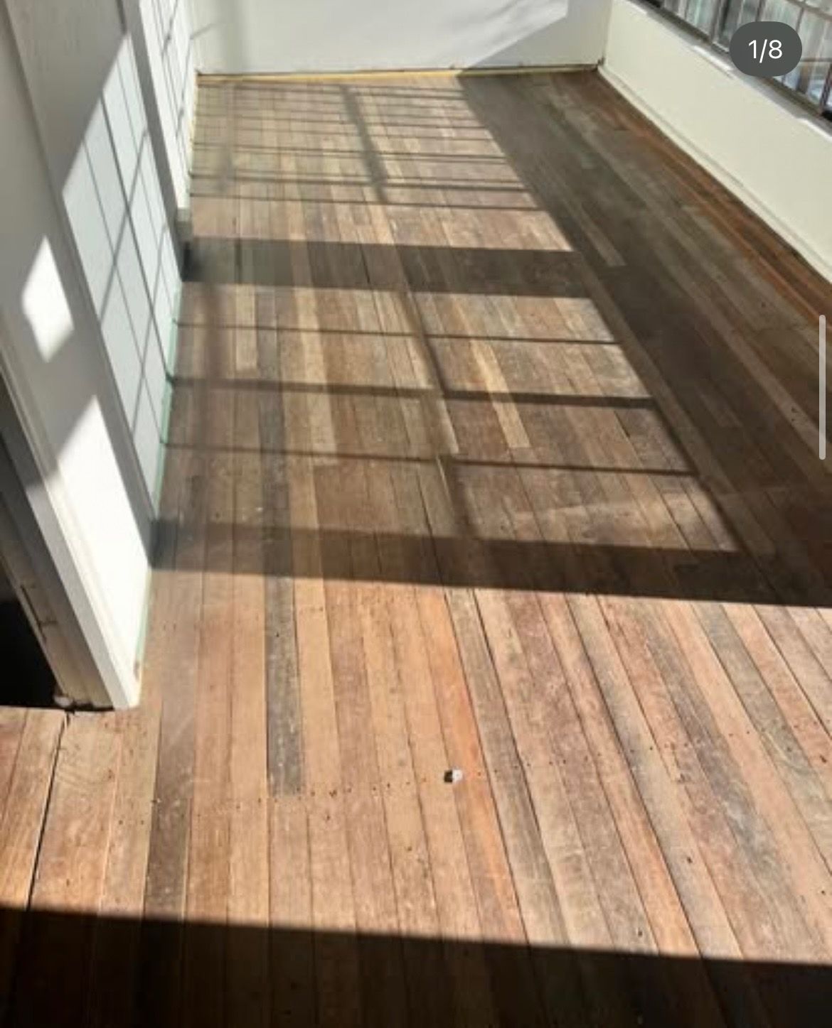 A Wooden Floor in a Room With Stairs and a Sink — Tweed Coast Cork & Timber Floors In Tweed Heads, NSW