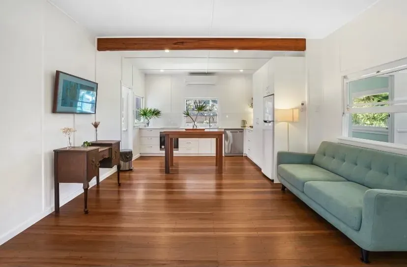 A Living Room With a Couch, Table and Television — Tweed Coast Cork & Timber Floors In Tweed Heads, NSW