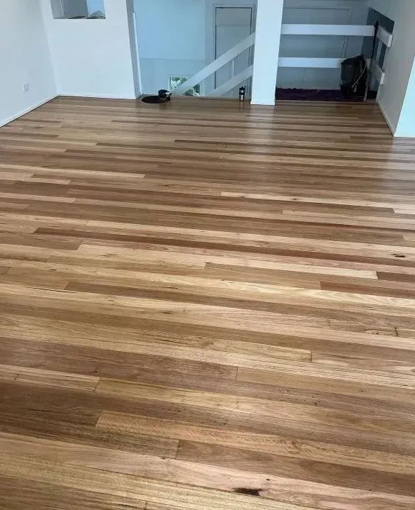 A Living Room With a Wooden Floor and Stairs — Tweed Coast Cork & Timber Floors In Tweed Heads, NSW