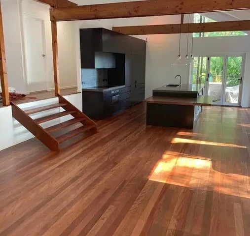 Kitchen With Wooden Floors and Stairs in a House — Tweed Coast Cork & Timber Floors In Tweed Heads, NSW