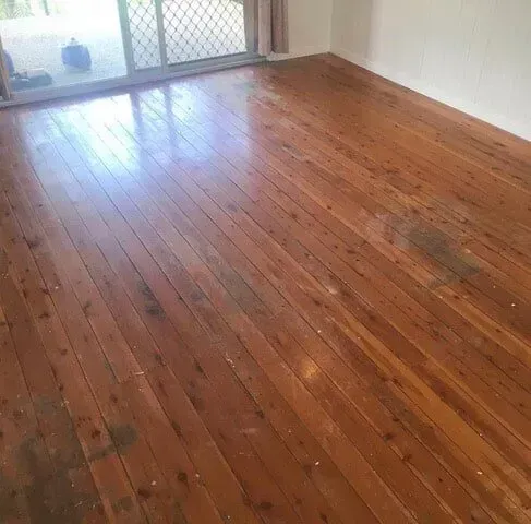 A Living Room With a Wooden Floor and a Sliding Glass Door — Tweed Coast Cork & Timber Floors In Tweed Heads, NSW