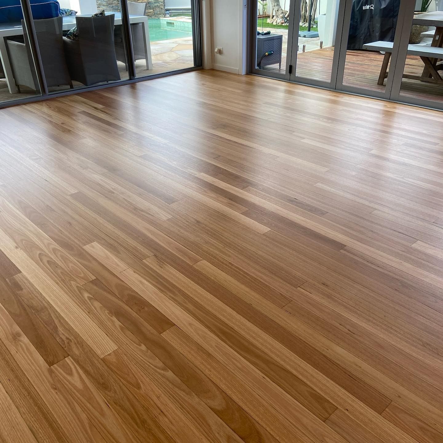 A Room With a Wooden Floor and a Window — Tweed Coast Cork & Timber Floors In Tweed Heads, NSW