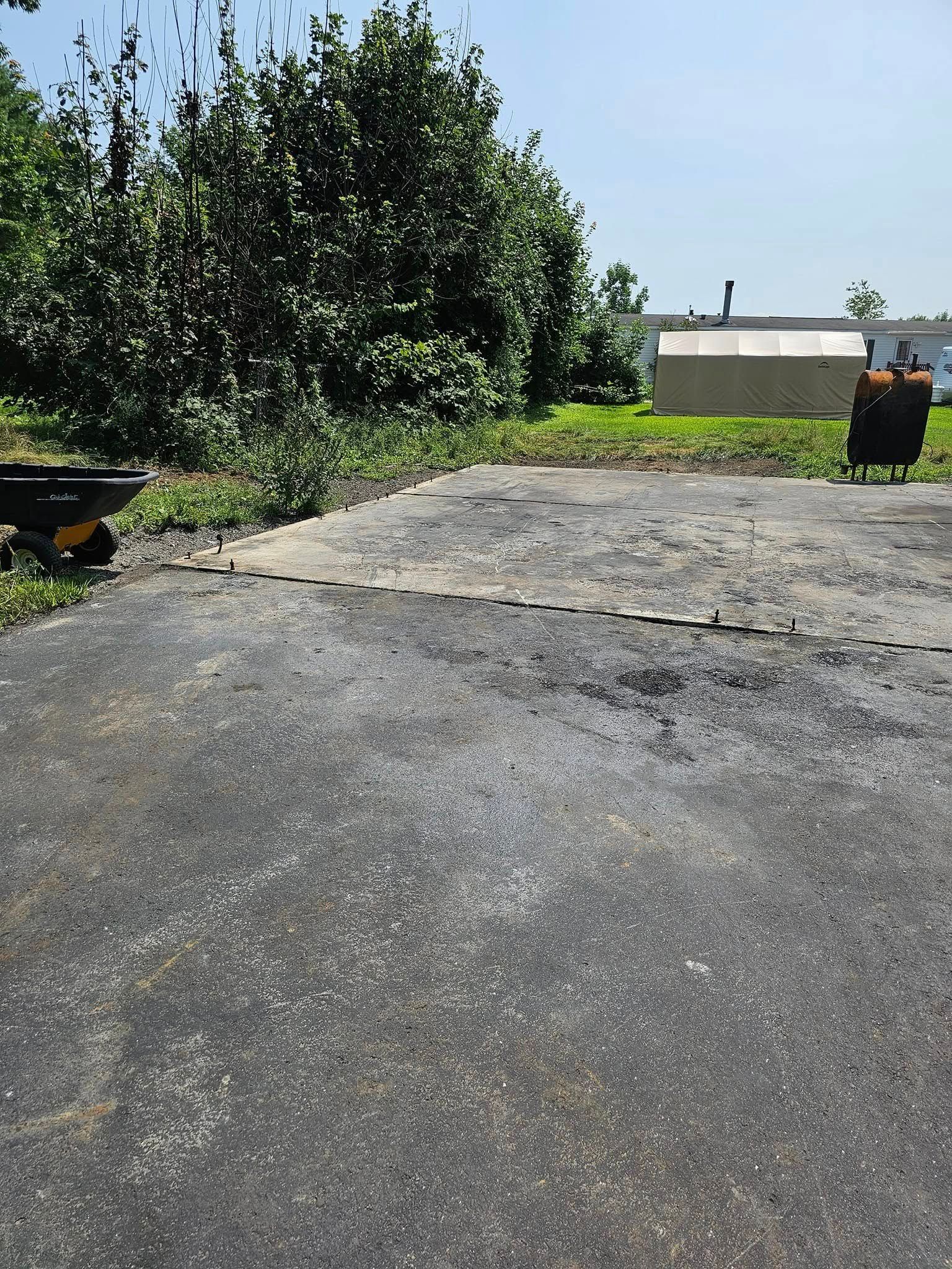 An empty parking lot with a wheelbarrow in the foreground