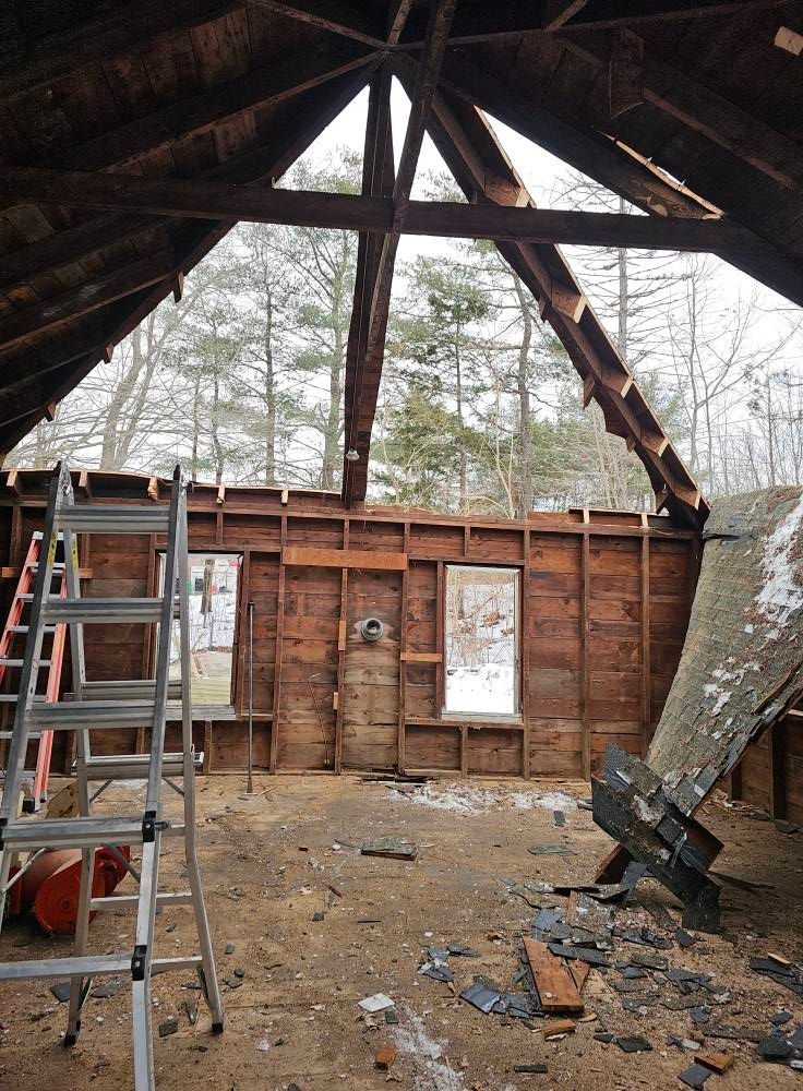 A ladder is in the attic of a house under construction