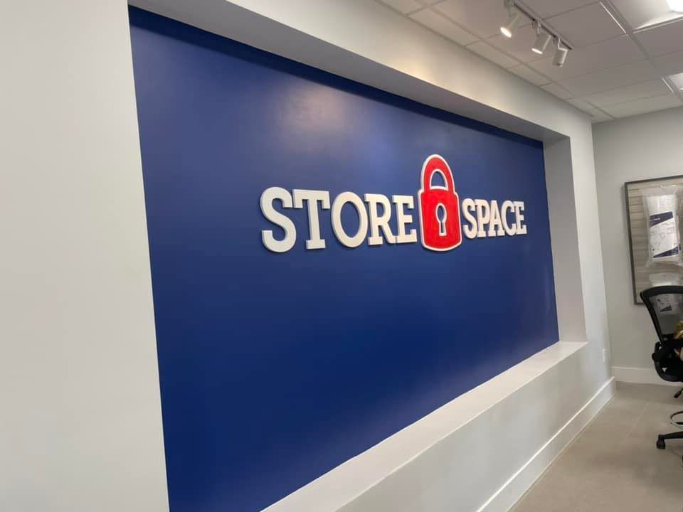 A blue wall with the words store space on it