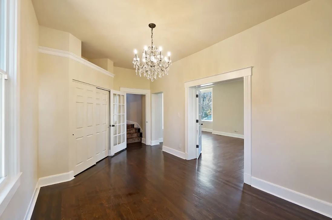 A kitchen with white cabinets and stainless steel appliances.