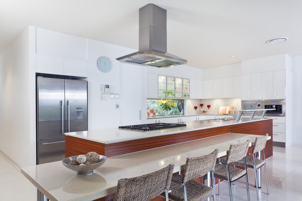 A Kitchen with White Cabinets and Stainless Steel Appliances — Bestbuy Kitchens in Yandina, QLD