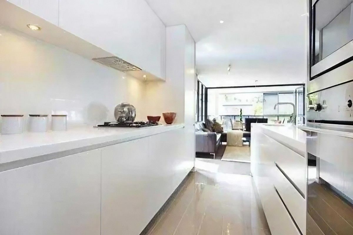 A Kitchen with White Cabinets and Stainless Steel Appliances — Bestbuy Kitchens in Yandina, QLD