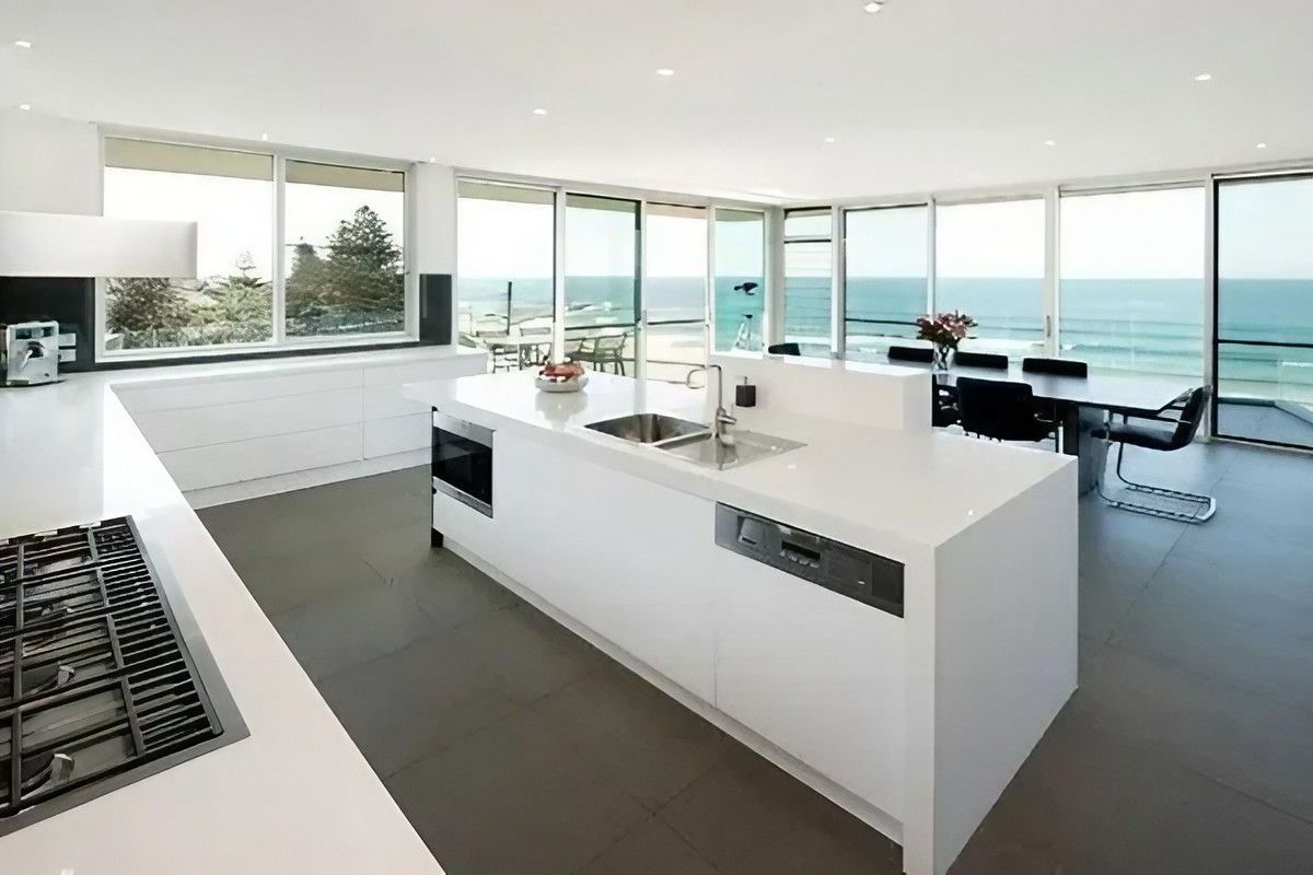 A Kitchen with A Large Island and A View of The Ocean — Bestbuy Kitchens in Yandina, QLD