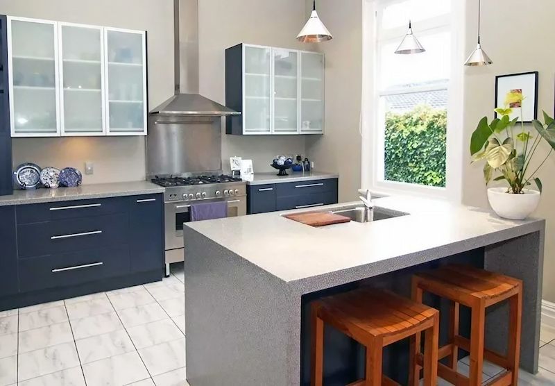A Kitchen with A Large Island and Stools — Bestbuy Kitchens in Yandina, QLD