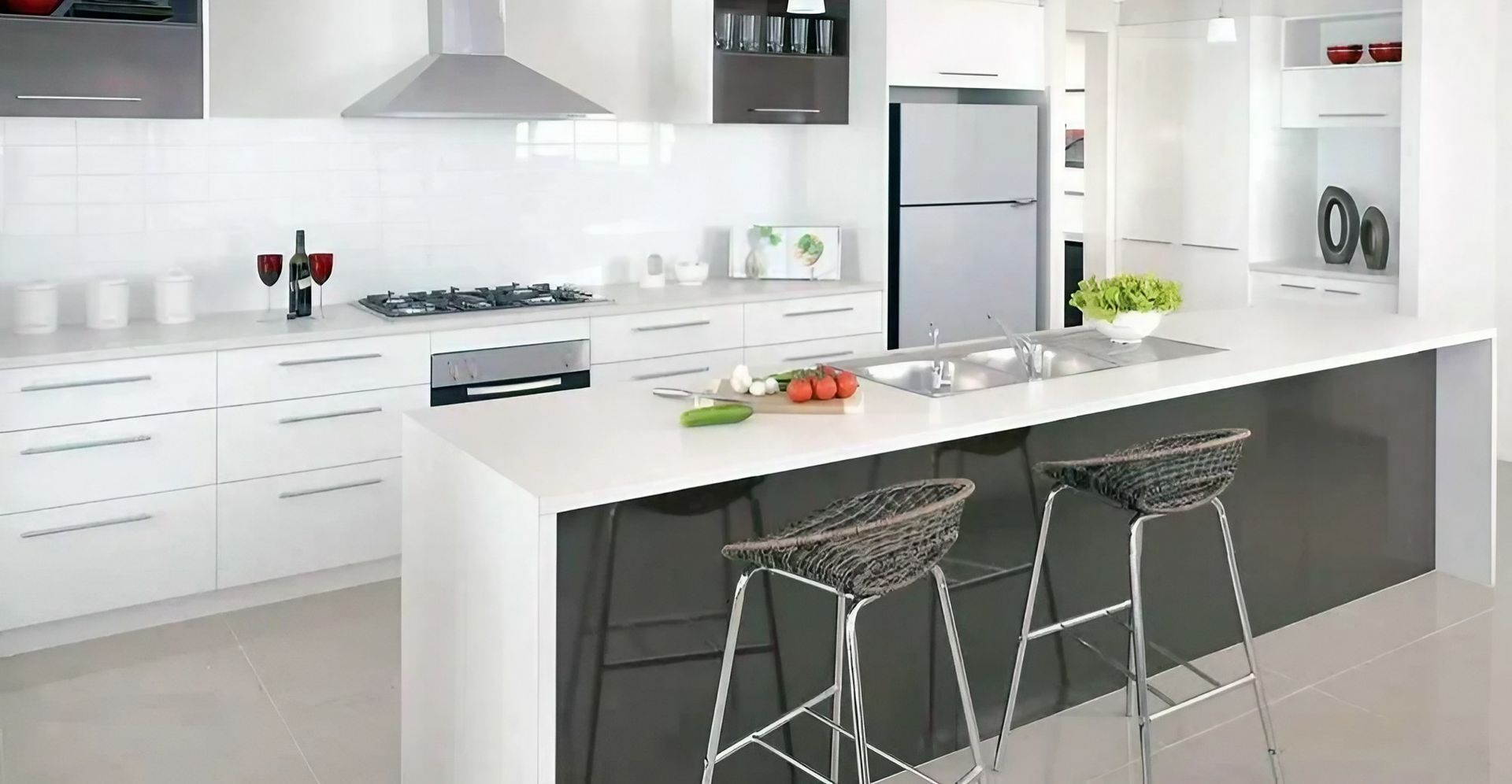 A Kitchen with Black and White Cabinets and Stools — Bestbuy Kitchens in Yandina, QLD