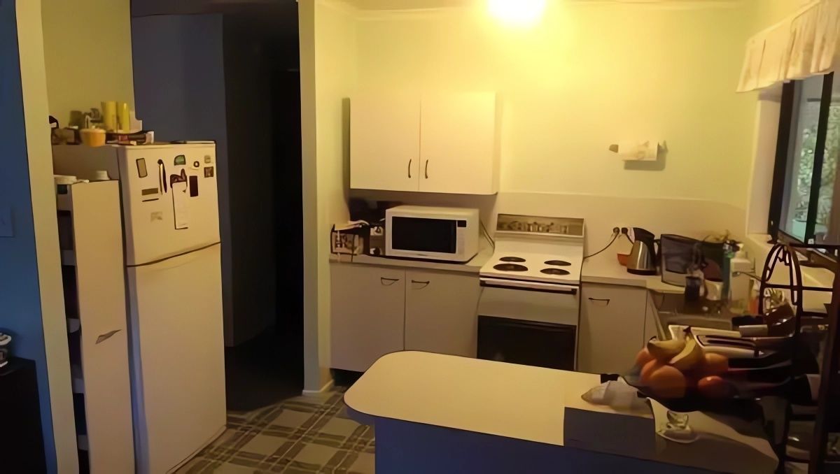 A Kitchen with A Refrigerator Stove and Microwave — Bestbuy Kitchens in Yandina, QLD