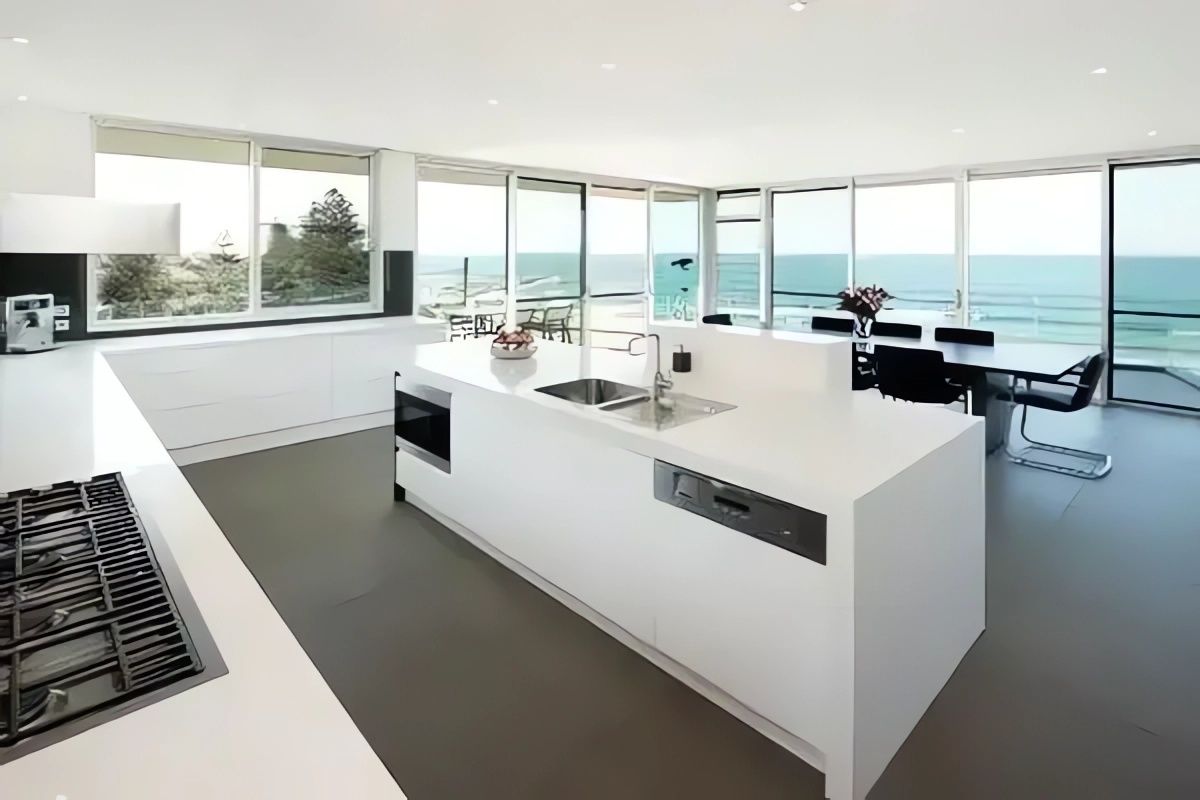 A Kitchen with A Large Island and A Stove Top Oven — Bestbuy Kitchens in Yandina, QLD