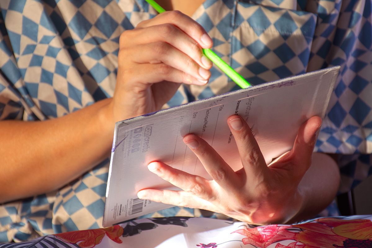 Person drawing on small canvas | NDIS Painting Classes by Spotty Dog Studios on the Gold Coast