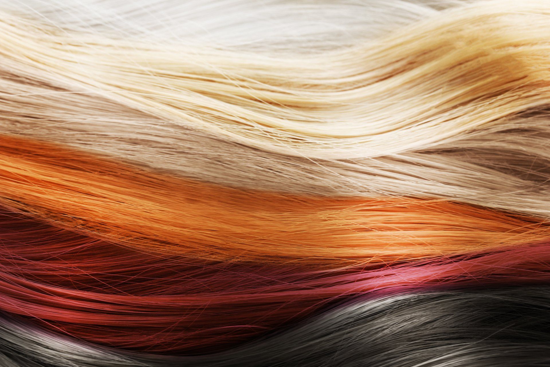 A close up of a bunch of different colored hair.